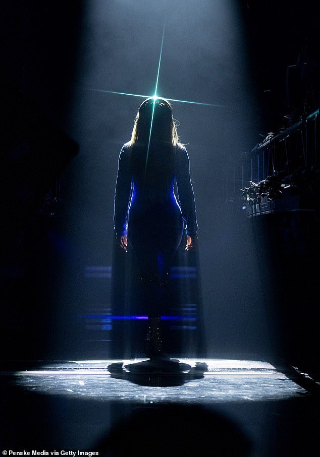 Lopez entered the stage with just her silhouette showing under a spotlight
