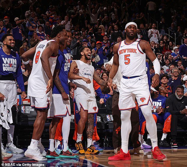 Precious Achiuwa celebrates with his teammates during the Knicks' crucial win in Game 5