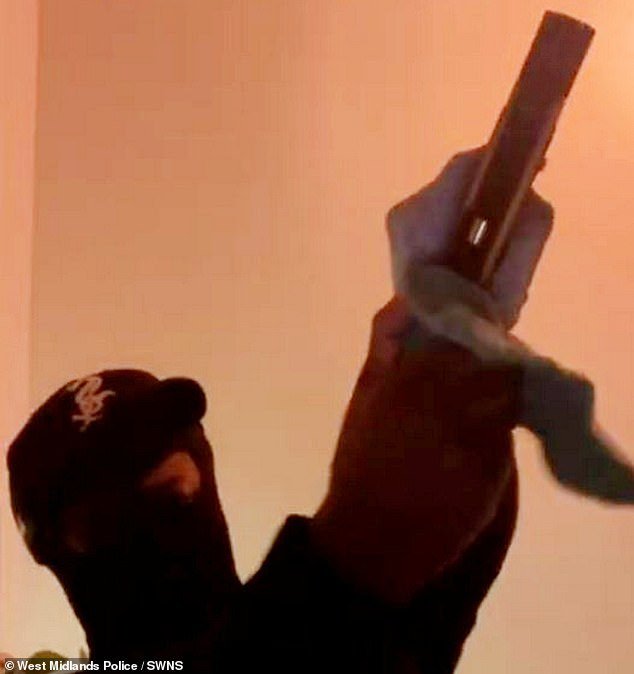 Smith is pictured here in an incriminating video unloading bullets from the pistol he possessed