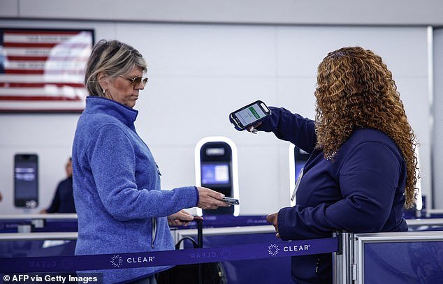 A TSA agent stops a passenger as they try to get through the airport in the US (stock)