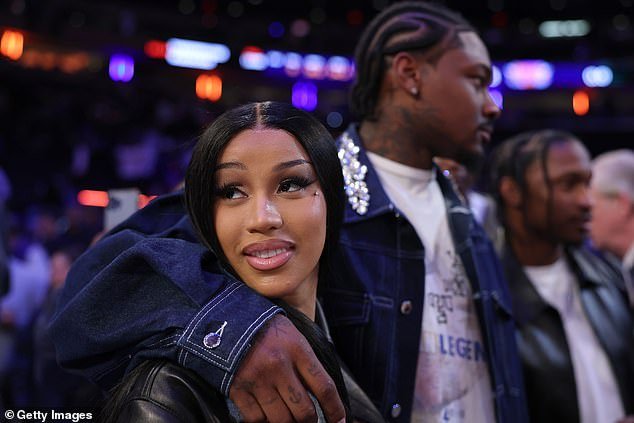 Cardi B looked utterly smitten as she made her first public appearance with NFL player Stefon Diggs at Madison Square Garden in New York on Monday