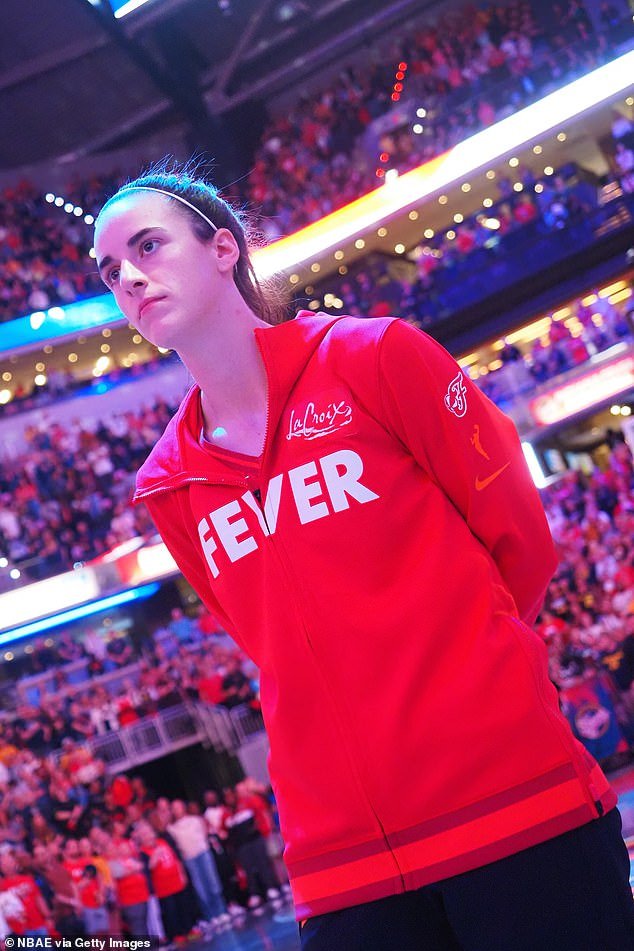 Caitlin Clark of the Indiana Fever stands for the National Anthem before Saturday's opener