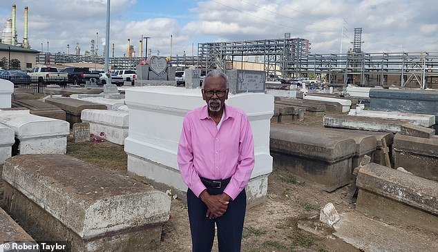 Robert Taylor (pictured) stands among the family cemetery which was once part of the sugarcane fields but now sits within the Marathon oil plant facility