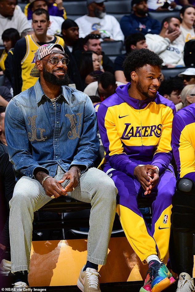 LeBron and Bronny James of the Los Angeles Lakers looks on during a March 16 game