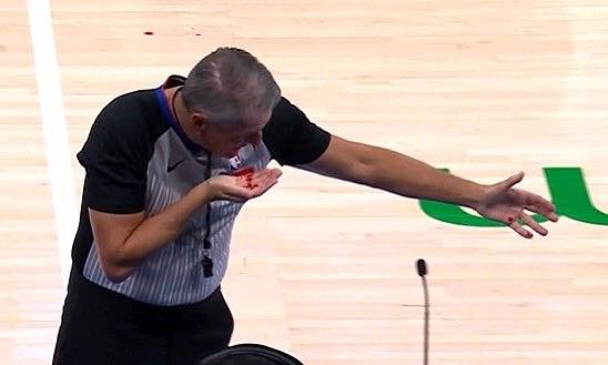 NBA referee Scott Foster was tended to by medical professionals after taking a grisly slap