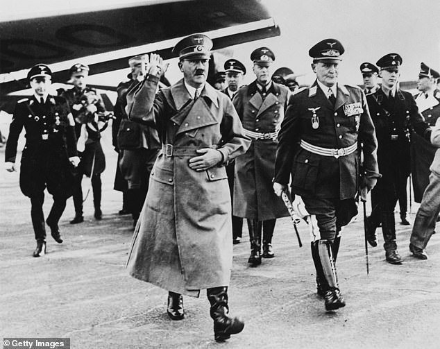 Adolf Hitler with top officials in 1938. The Nazi system of theft, slave labor and money laundering is still not fully understood
