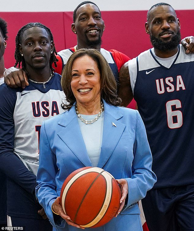 U.S. Vice President Kamala Harris poses for a group picture with LeBron James and other members of the U.S. men's Olympic basketball team,