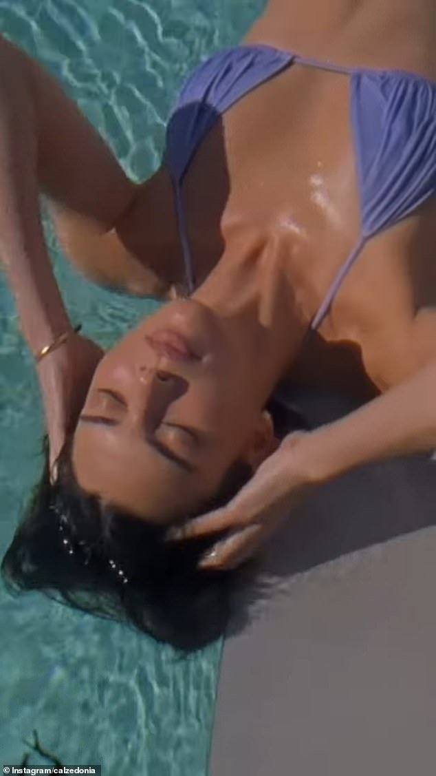 In video footage shared to Calzedonia's Instagram, the supermodel luxuriated poolside