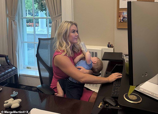 Karoline Leavitt works in her West Wing office while feeding nine-month-old Niko
