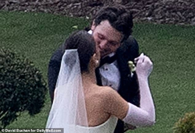 The happy couple put on a loved-up display in front of their intimate crowd of guests