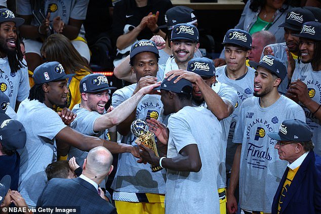 Teammates mob Pascal Siakam after he won the ECF series MVP award on Saturday