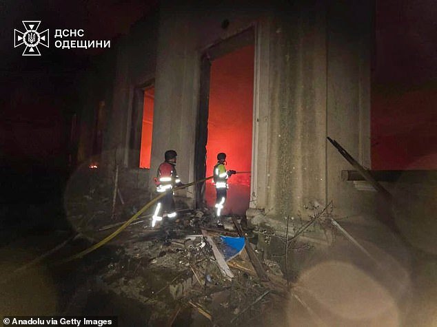 Firefighters work to extinguish a blaze in Odesa, where a Russian drone strike hit a medical facility, a children's centre and a high school