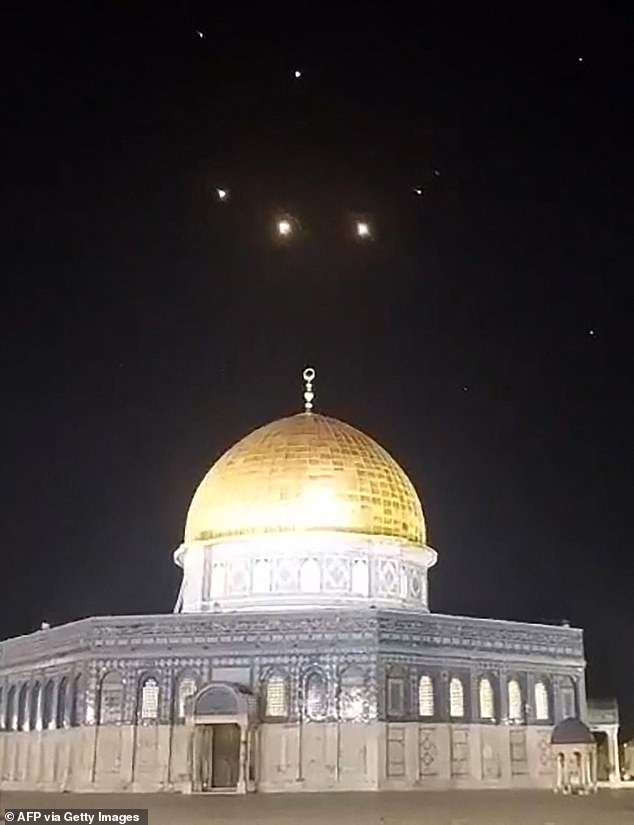 Rocket trails in the sky above the Al-Aqsa Mosque compound in Jerusalem, Israel