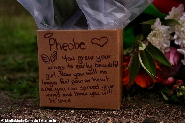 A makeshift memorial has appeared at the ramshackle, rubbish-strewn Gin Gin home