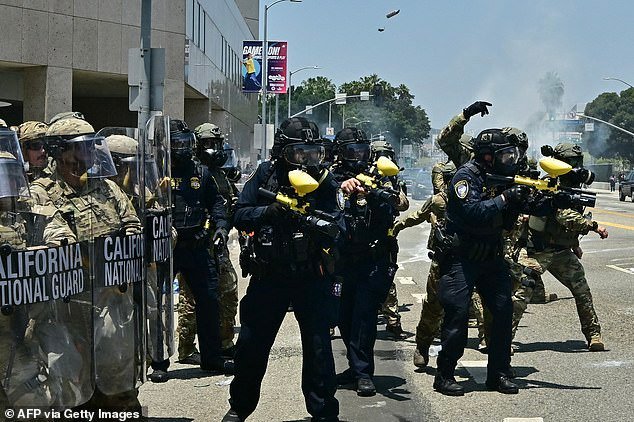 Law enforcement clash with demonstrators outside the Metropolitan Detention Center, MDC, in downtown Los Angeles, California on June 8, 2025