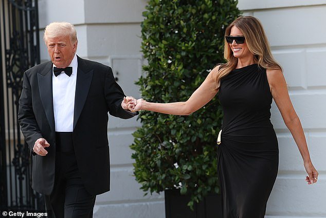 President Donald Trump (left) escorting first lady Melania Trump (right) outside of the White House as they set out for the Kennedy Center