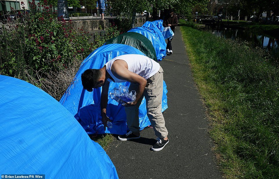 A number of homeless migrants subsequently pitched tents in a private park in south Dublin on Thursday. However, those men left the area on Friday. Later on Friday, Taoiseach Simon Harris defended the Government's handling of the asylum seeker accommodation issue. He said 'makeshift encampments' on public roads and footpaths were illegal, and 'never the solution'. 'It's also not in the interest of the people who are sleeping in those tents, people who don't have access to proper sanitation,' he said.