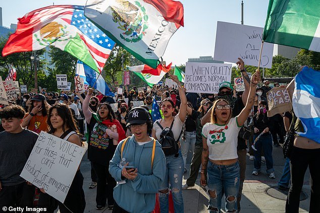 Protesters march through downtown Los Angeles on Wednesday as demonstrations continue after a series of immigration raids began last Friday