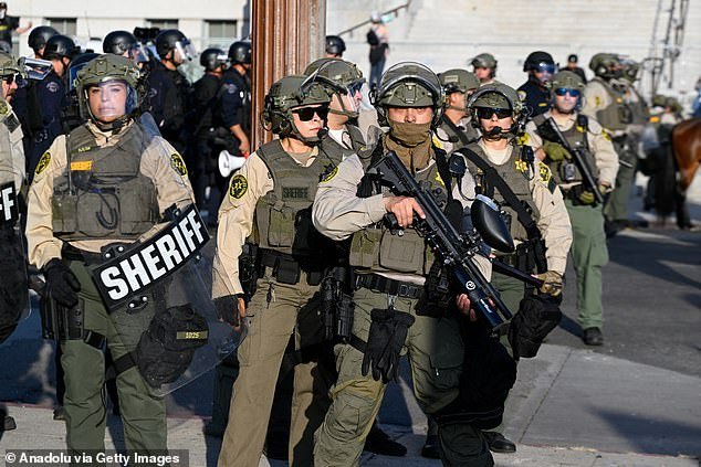 Sheriffs are seen as more than a thousand of anti-ICE protesters gathered at Pershing Square on Wednesday and marched to City Hall as they were confronted by huge number of police including mounted police in Los Angeles