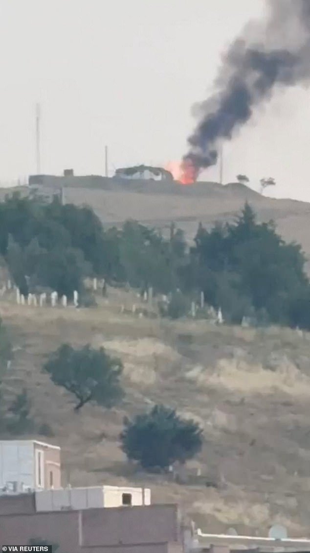 Smoke and flames rise, following Israeli strikes on Iran, in Piranshahr, Iran in this screen grab obtained by Reuters