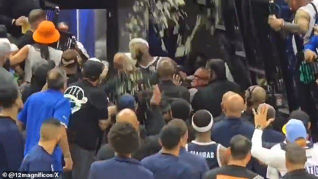 As he was taken down the tunnel, fans threw drinks at him and the red mist then descended