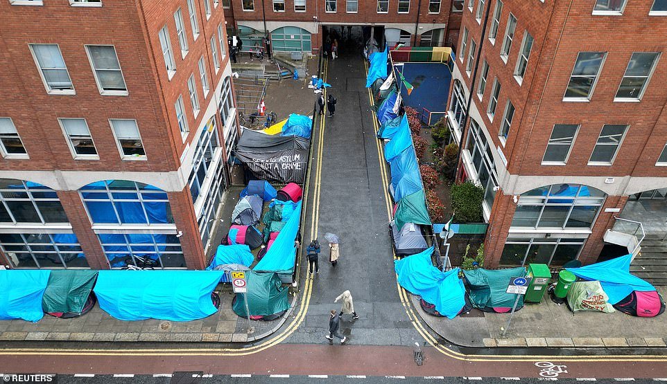 'The tents on Mount Street are not acceptable, not acceptable for migrants and not acceptable for residents living in the area either,' he said. 'We don't envisage them returning. The state has, within its powers, the capacity to make sure we don't have tents back up on Mount Street or other streets and in our view the Government is very clear that we can't have tents in streets adjacent to neighbourhoods. 'There is a determination on the Government's side to use capacity and powers to ensure that it doesn't occur into the future.' Irish politicians have in recent weeks voiced alarm that large numbers of migrants are taking advantage of the invisible border with Northern Ireland, flooding south into the Republic to avoid being deported to Rwanda under new Tory plans to mitigate the impact of immigration. Taoiseach Simon Harris has vowed to pass new laws to facilitate returns of migrants, after the country's courts declared the UK cannot be classed as 'safe' due to the pact with the African state.