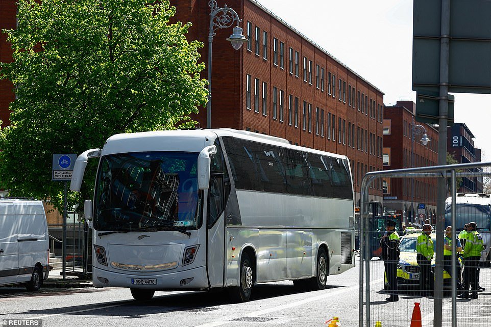 The operation got underway at 6.30 am this morning when officers descended on the tent city and began ushering occupants into the street. Buses arrived just after 8 am and began loading migrants on board ahead of their transfer to the temporary accommodation. The coaches were flanked by police cars to 'ensure the safe movement' of the asylum seekers. The police escort and the security teams who will be stationed at the migrant accommodation sites at Citywest Hotel and Crooksling are of paramount importance amid a series of anti-immigration protests and demonstrations, some of which have turned violent. Several buildings earmarked to house asylum seekers in Ireland have previously been surrounded by protesters. One factory set to host migrants in Coolock in north Dublin was taken over by disgruntled demonstrators, and several others have been subject to arson attacks in recent months as the Irish public voices its displeasure with the rate of immigration.