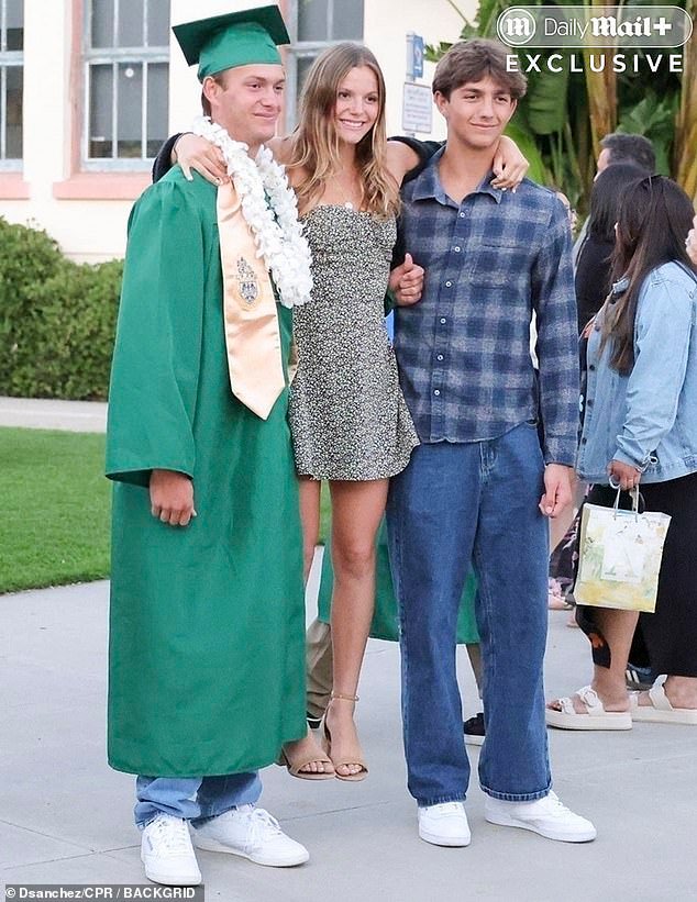Although unconfirmed, it appeared that Kevin and Christine's other children ¿ Hayes Logan, 16, and Grace Avery, 15 ¿ were also in attendance at the graduation, posing for photos with Cayden
