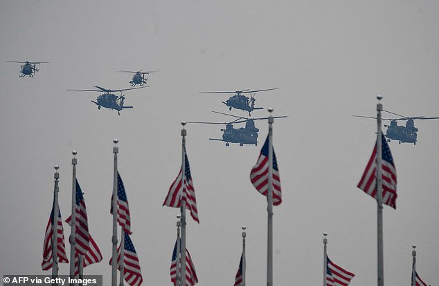 A batch of Chinook helicopters fly over the National Mall during Saturday's 250th Army anniversary parade