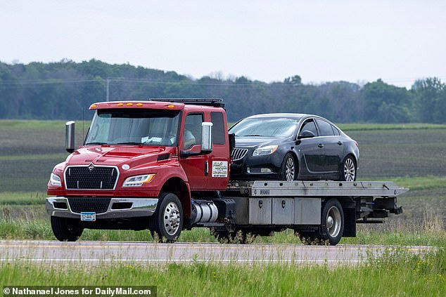 By around 4pm Sunday, a four-door dark blue Buick Regal sedan was removed from the search area on a flatbed truck
