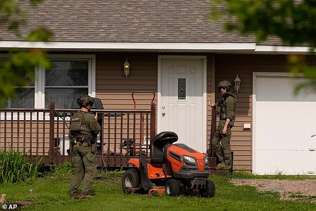 Authorities went house to house in rural Belle Plaine, Minnesota on Sunday as the search for Boelter continued