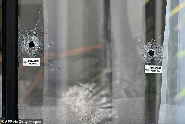 It's believed Ghanim was shot seven times during the attack (pictured, bullet holes at the scene)