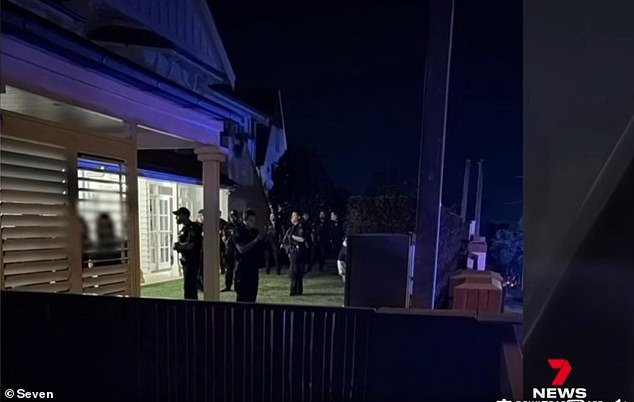Police in the grounds of the Clayfield house last Thursday evening as the 15-year-old boy was arrested and distraught teenage party guests were escorted from the crime scene