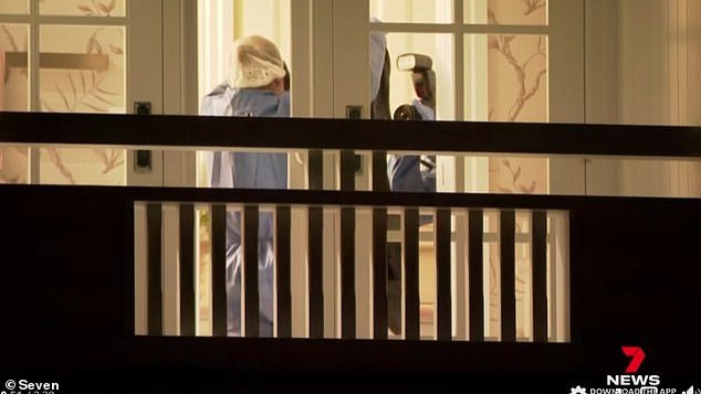 Forensic police seen in a room upstairs at the Clayfield house where Mr Josephson was found dead