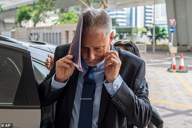 Washington state Senator Jeff Wilson was arrested in Hong Kong in October after he accidentally traveled there with a pistol in his carry-on luggage by mistake. He is pictured arriving at court in Hong Kong before the charge was dismissed