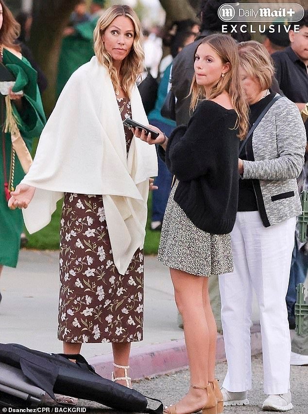 The Oscar-winning actor, 70, and the former handbag designer, 51, (pictured on left with the former couple's daughter Grace, 15) kept their distance at the event